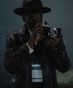 man-holding camera-journalist